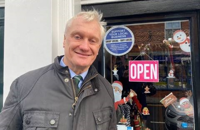 Graham next to support a local business sign Small Business Saturday 