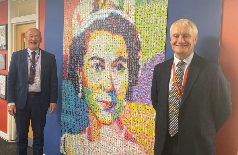 Graham Stuart MP and Michael Loncaster Standing Next To A Portrait of the Queen