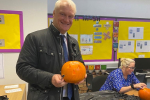 Photo of Graham Stuart carving a pumpkin at Withernsea High School