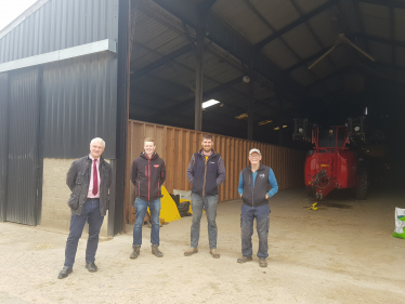 Graham Stuart, Tom Screeton (Agriculture Senior Fieldsperson, Birds Eye), Guy & Chris Shelby (farmers) standing in front of farming equipment