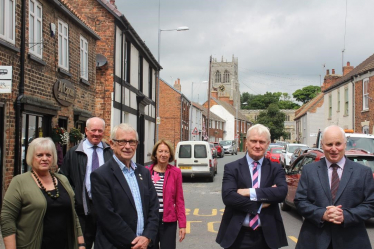 Graham with Ward Councillors at Preston, standing next to traffic.